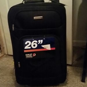 Dunlop 26 in travel suitcase